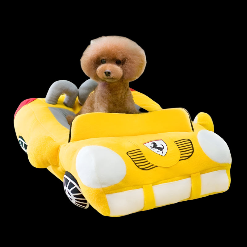 Dog sitting on a yellow car-shaped pet bed in a living room.