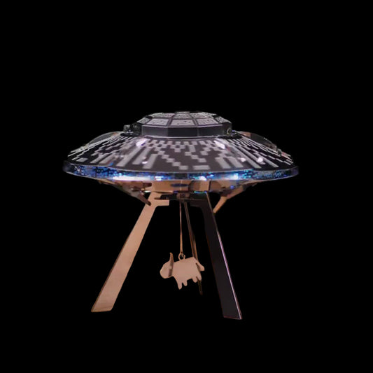Model of a UFO on a stand with a dark background