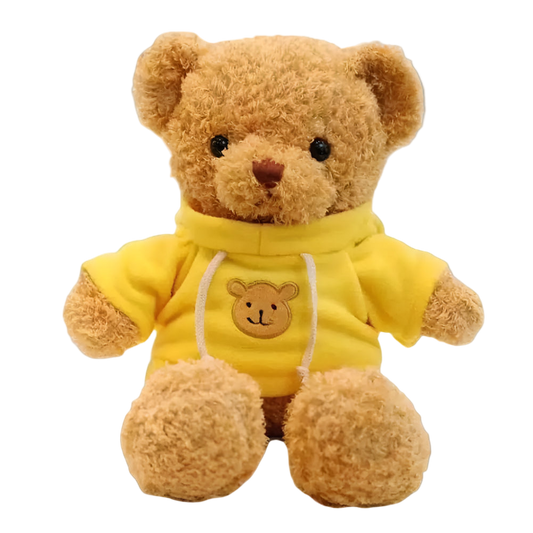 Teddy bear wearing a yellow hoodie with a bear face design on a white background
