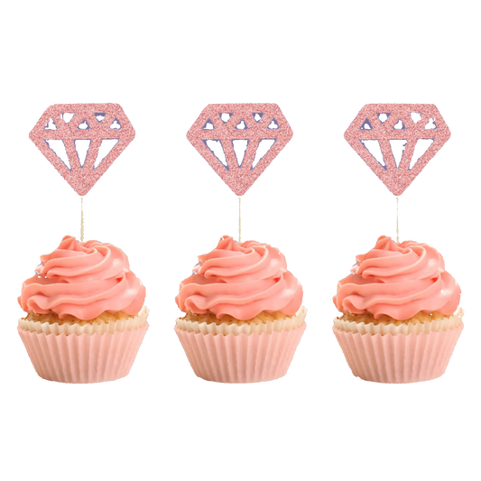 Three cupcakes with pink frosting and diamond-shaped cupcake toppers on a white background