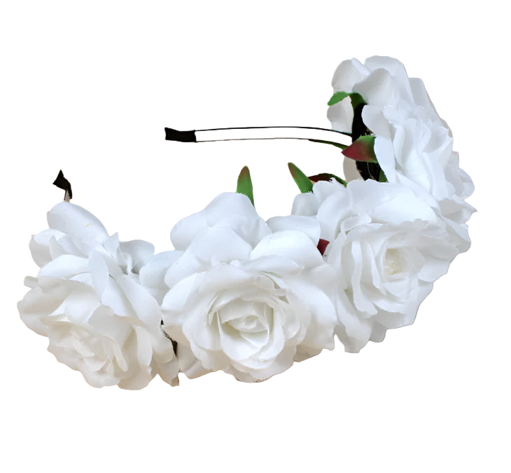 White floral headband on a wooden surface with a white plate and green bottle in the background.