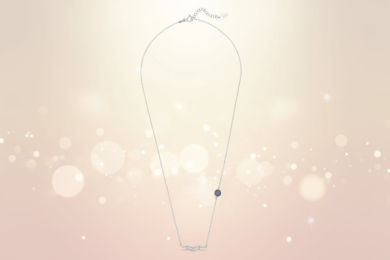 Necklace with a small round pendant on a white background