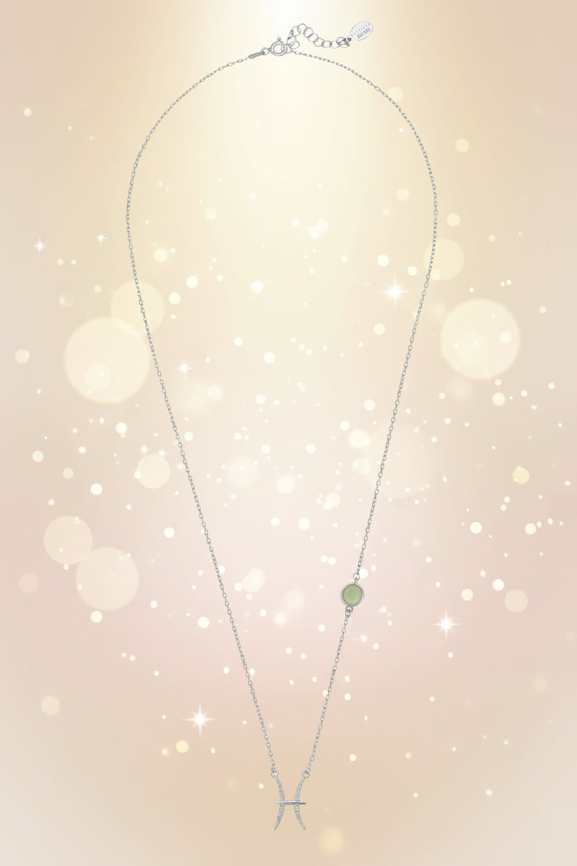 Necklace with a green pendant on a white background