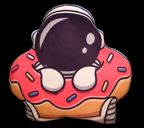 Donut-shaped cushion with cartoon character on a beige couch