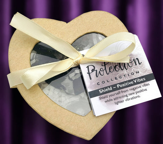 Heart-shaped box with a ribbon and a tag on a white background
