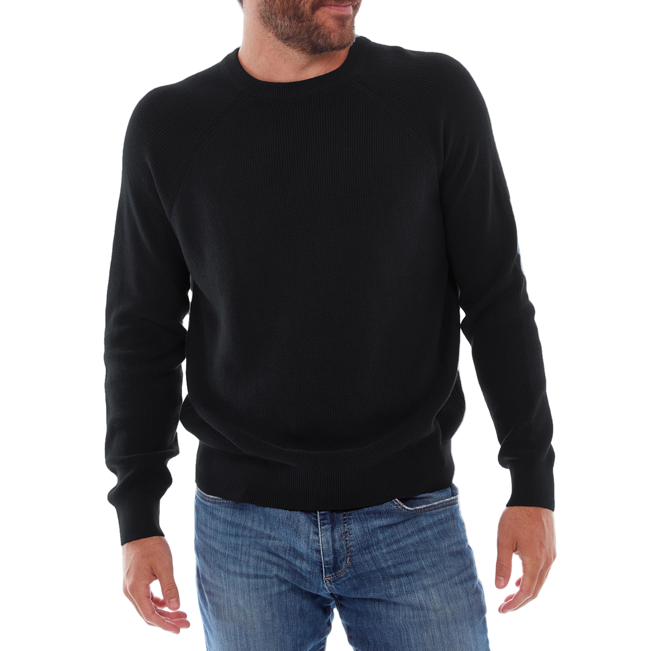 Person wearing a black sweater and blue jeans on a white background