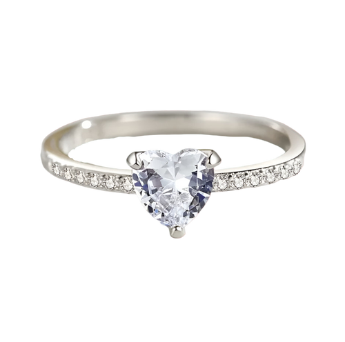 Silver ring with a heart-shaped gemstone on a light background