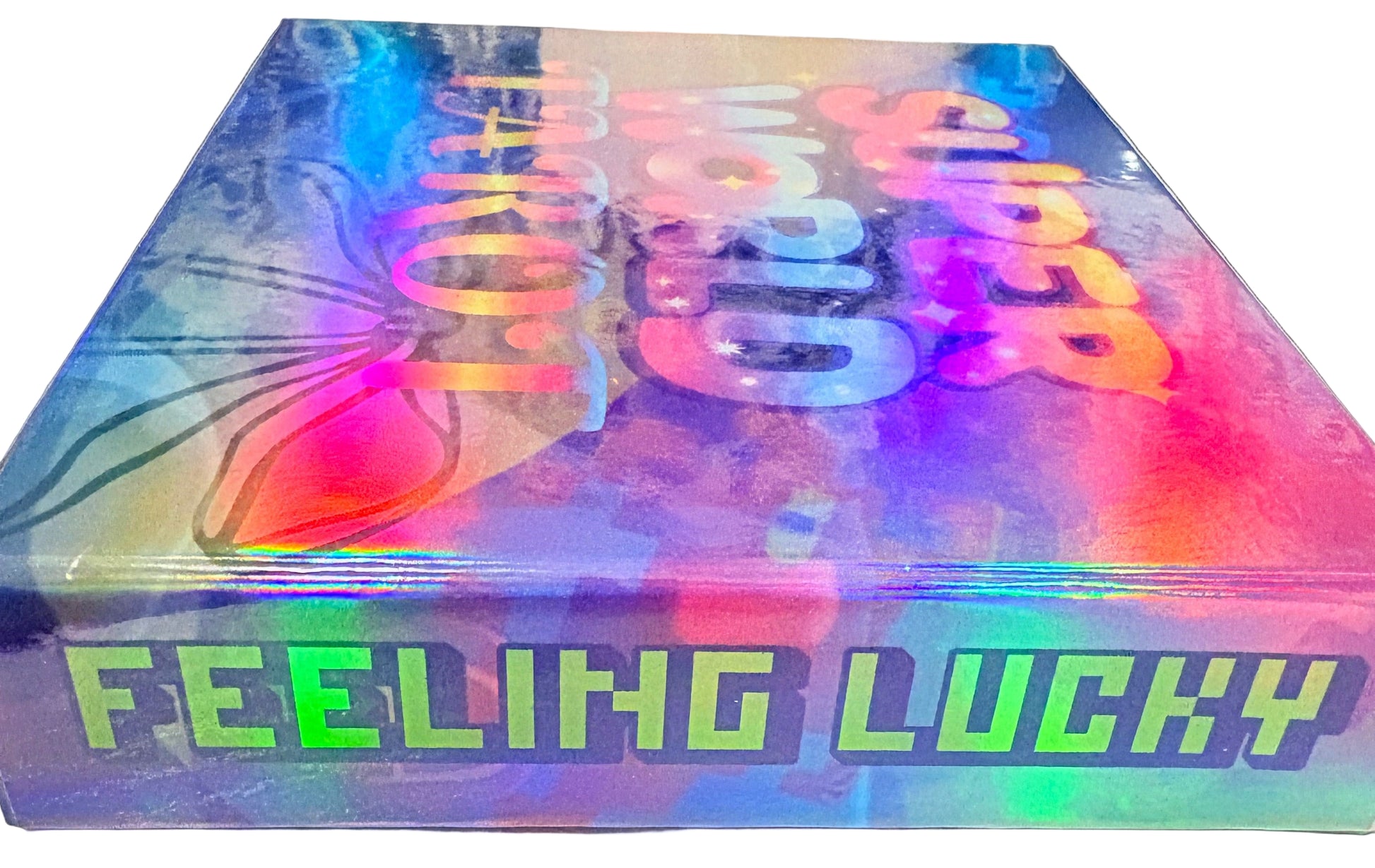 Colorful book with text 'Super World Tour' and 'Feeling Lucky' on a white background