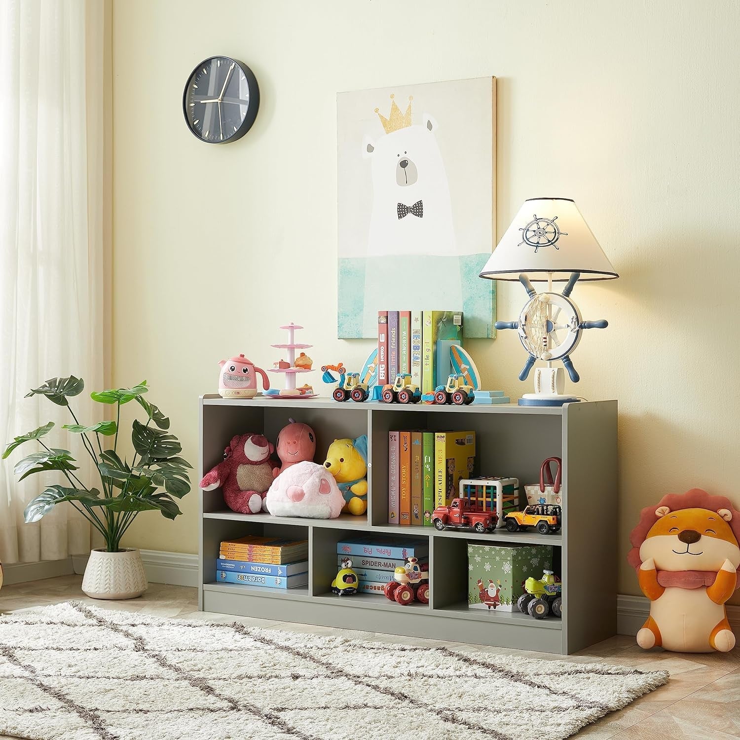 Children's room with a bookshelf, toys, and decorative items.