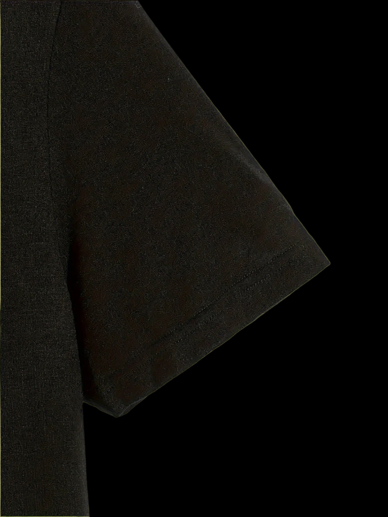 Close-up of a black t-shirt sleeve on a light background