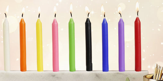 Colorful candles in a holder on a neutral background