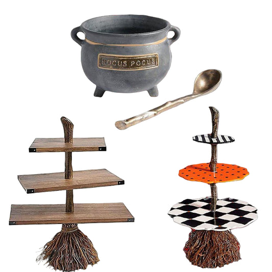 Halloween-themed items including a cauldron, spoon, tiered stand, and broom on a white background.