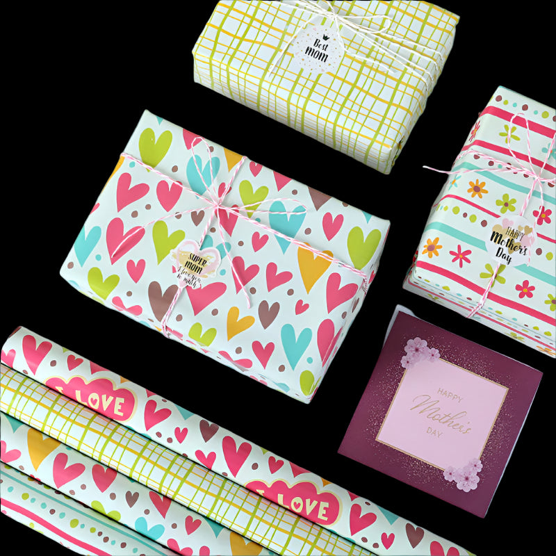 Colorful gift wrap with heart patterns and a Mother's Day card on a white background