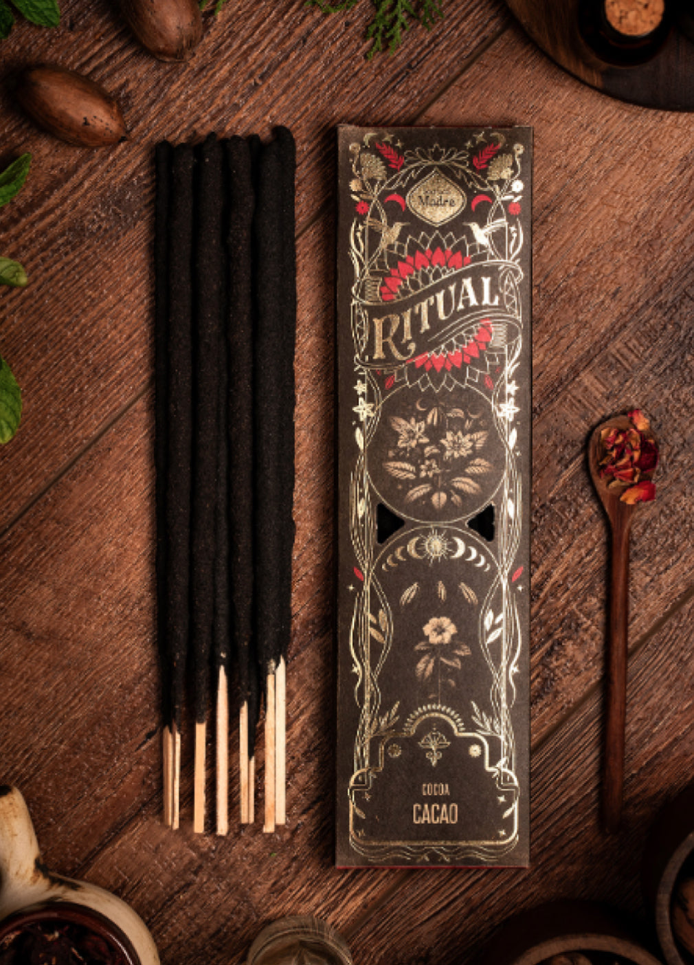 Incense sticks with decorative packaging on a wooden surface