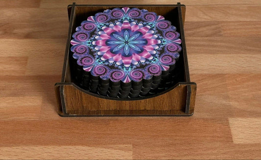 Decorative coaster with a colorful mandala design in a wooden holder on a wooden surface.