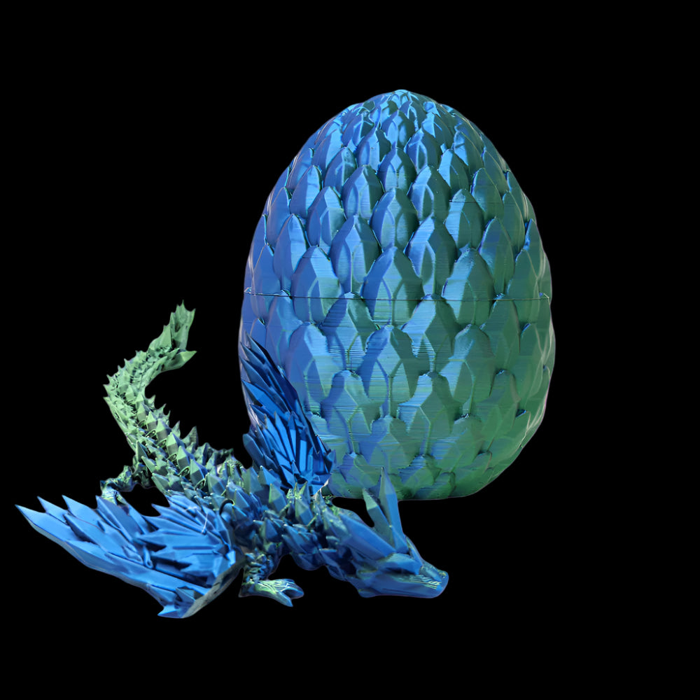 Blue and green dragon egg with a dragon model on a white background