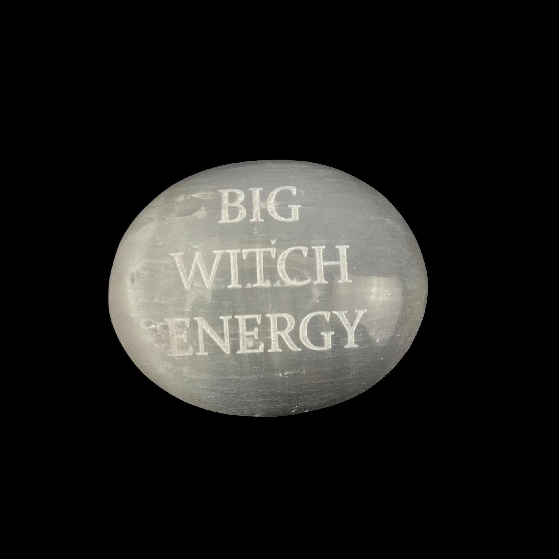Round stone with 'BIG WITCH ENERGY' text on a black background