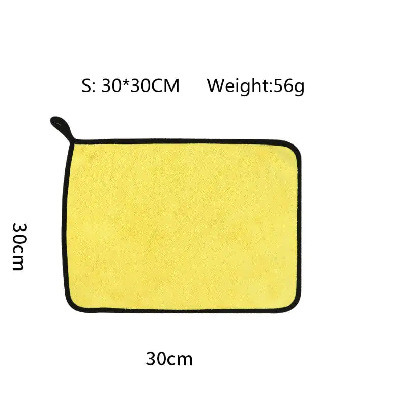 Yellow towel with dimensions and weight information on a white background