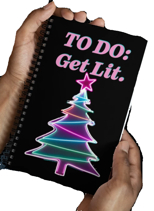 Notebook with a colorful Christmas tree design and text 'TO DO: Get Lit.' held by hands.