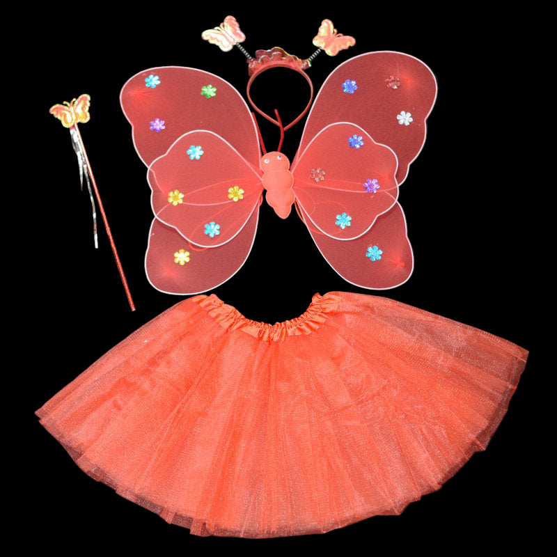 Butterfly costume set with wings, skirt, wand, and headband on a black background