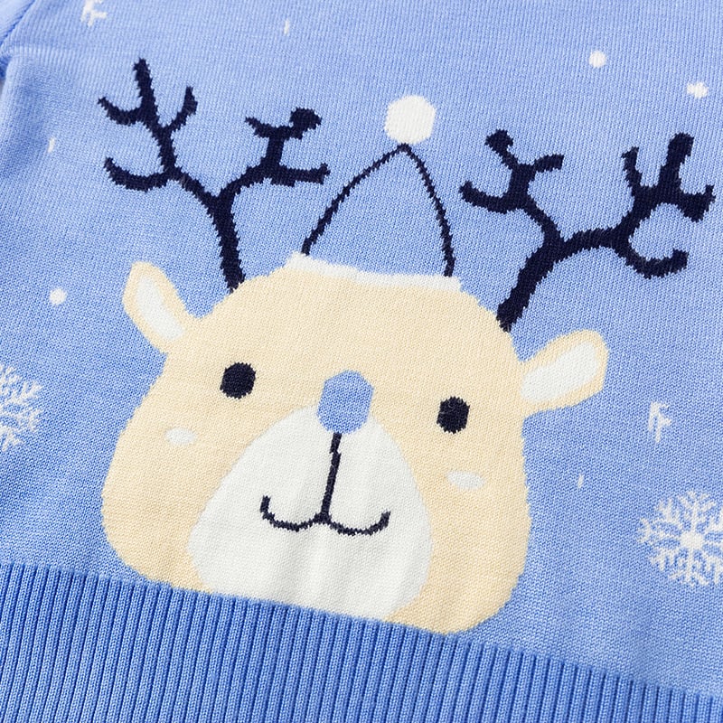 Blue sweater with a reindeer design on a light blue background