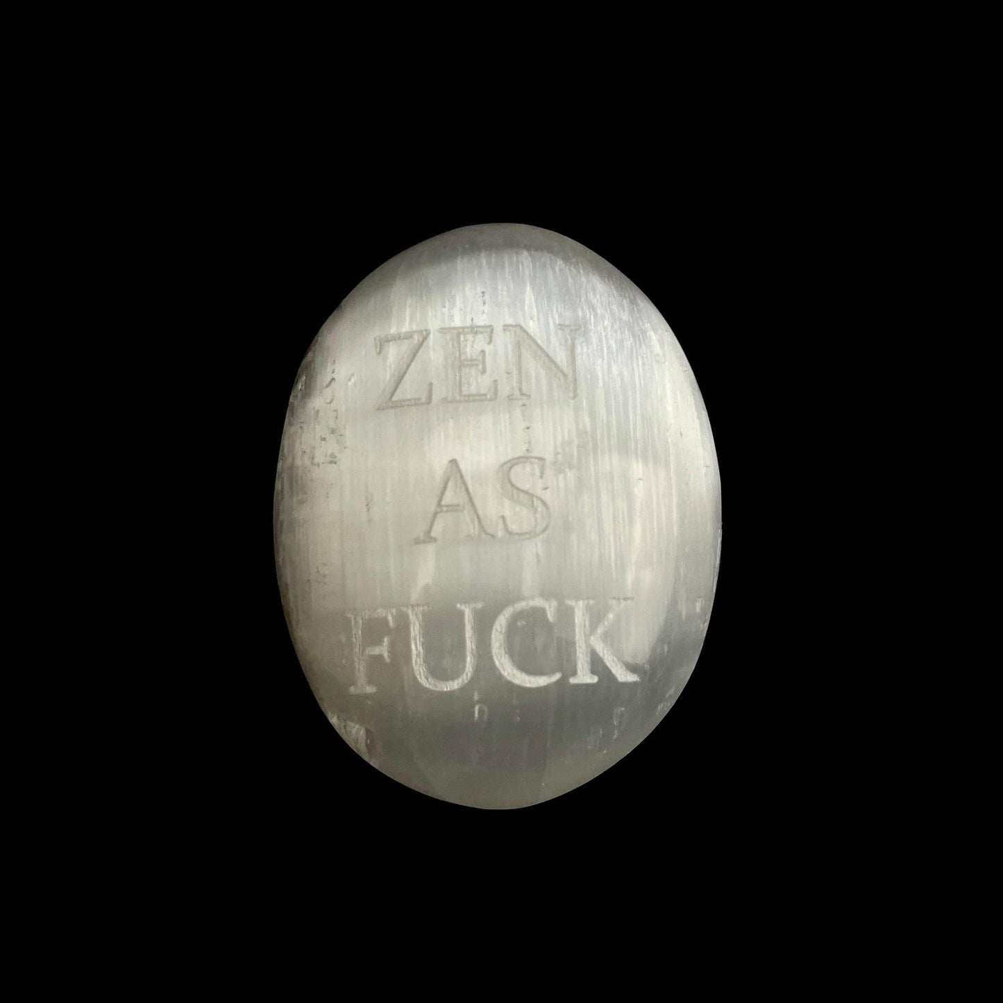 Crystal with 'Zen as Fuck' engraved on a black background