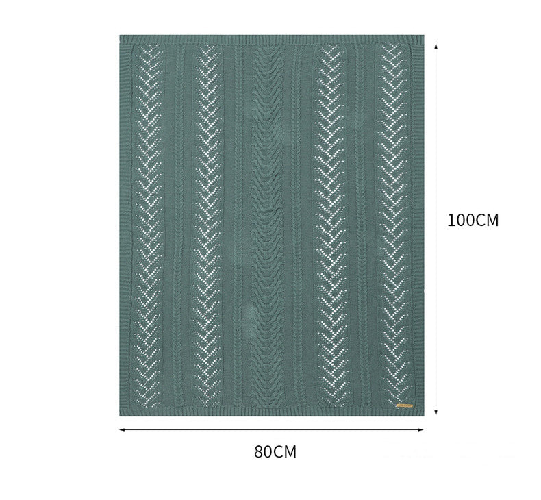 Green rug with white pattern and measurements on a white background