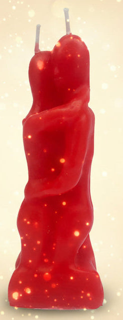 Red candle shaped like a person on a white background