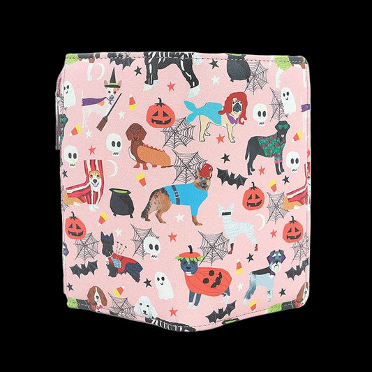 Pink wallet with Halloween-themed design featuring dogs, pumpkins, and ghosts on a white background.
