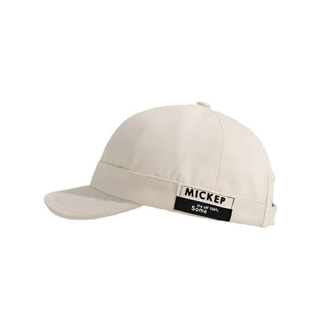 Beige cap with a patch on a white background