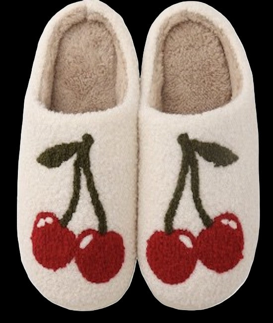 Pair of slippers with cherry design on a white background