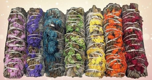 Set of colorful incense sticks in various scents on a white background