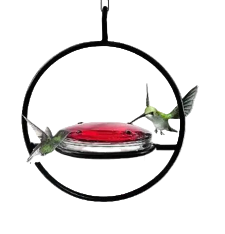 Hummingbird feeder with red dish and black metal frame, surrounded by pink and white flowers.