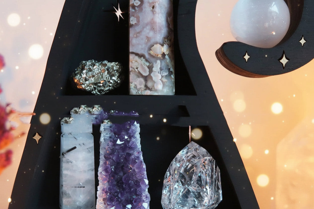 Decorative shelf with crystals and a moon-shaped object against a blurred background