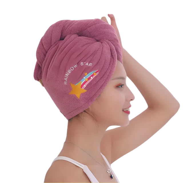 Woman wearing a pink towel with 'Rainbow Star' branding against a white background