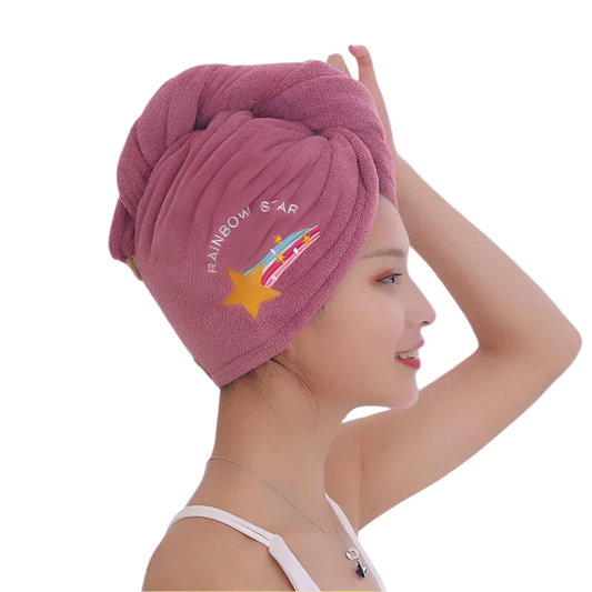 Woman wearing a pink towel with 'Rainbow Star' branding against a white background