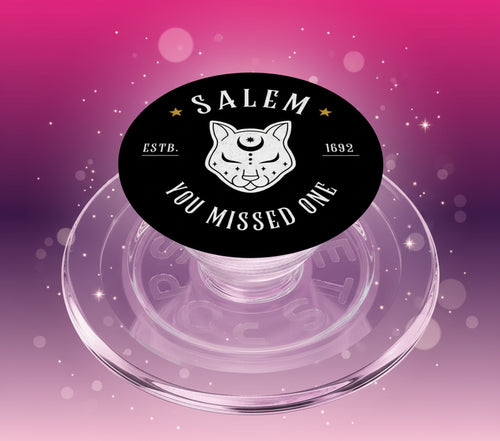 Phone pop socket with Salem design and text on a clear background