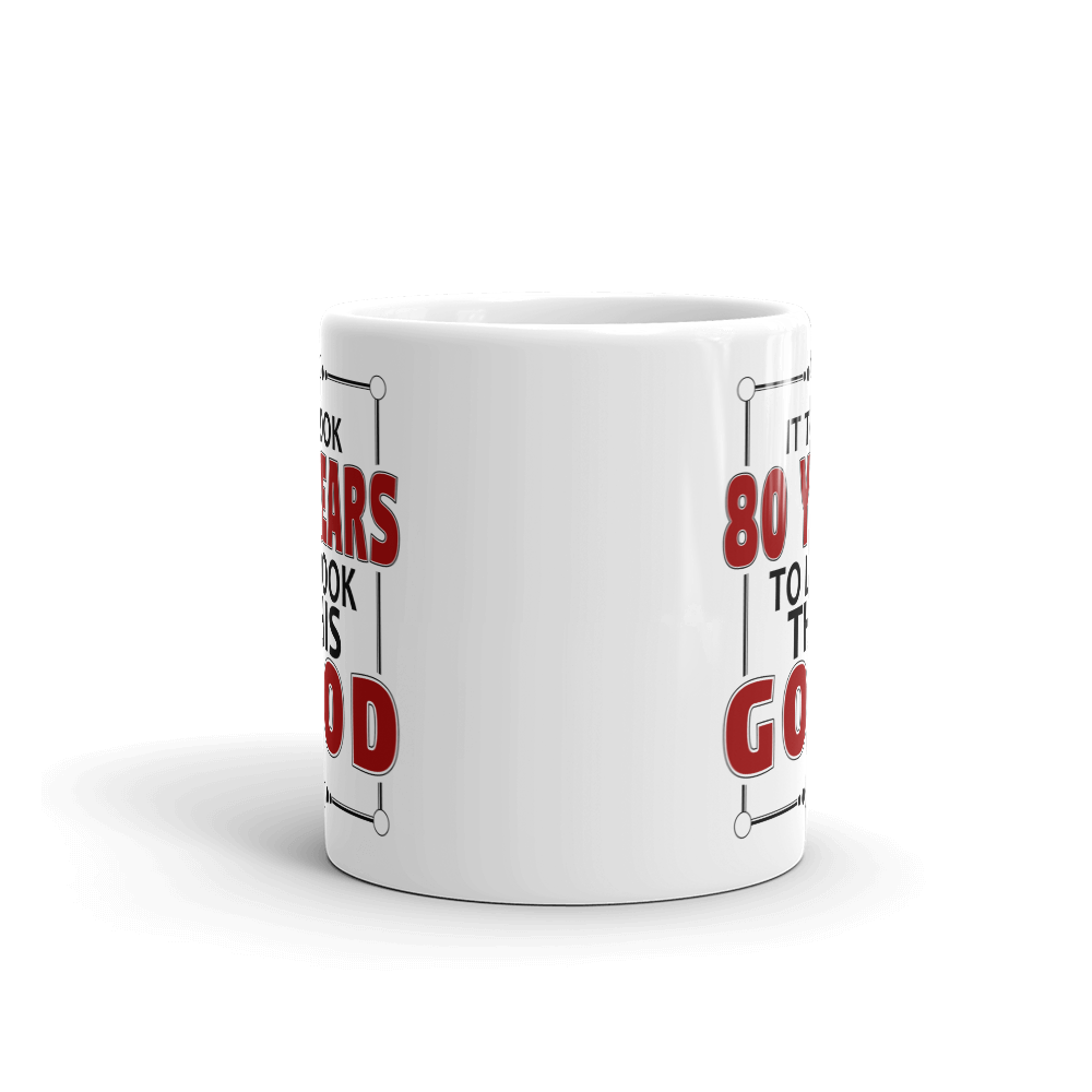 White mug with red and black text on a white background