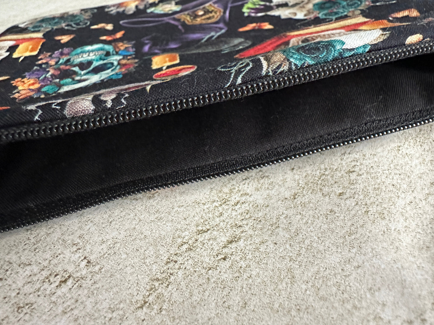 Colorful patterned pouch on a textured surface