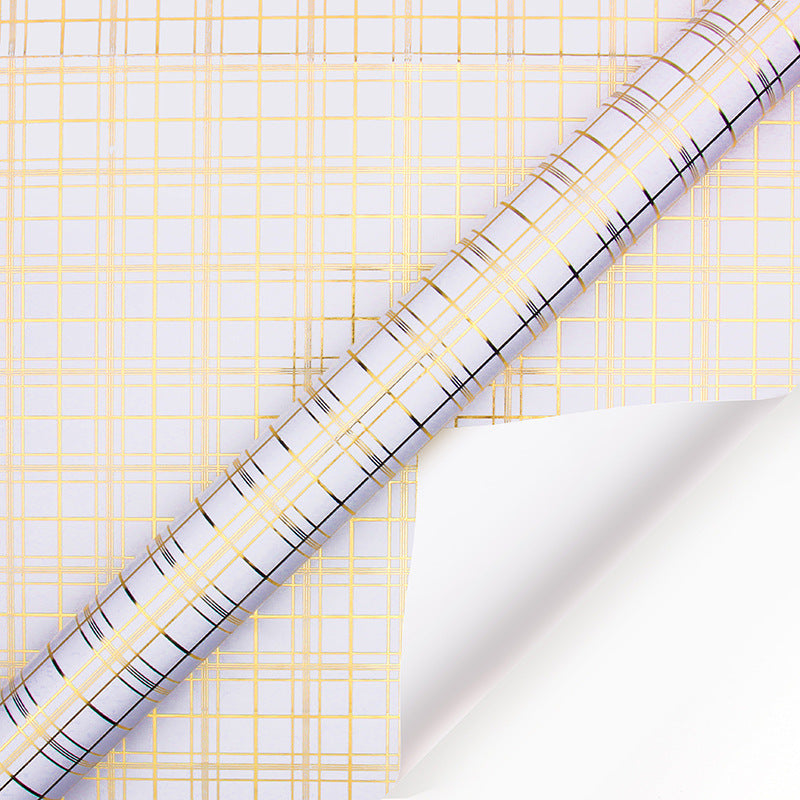Roll of paper with yellow and black grid pattern on a white background