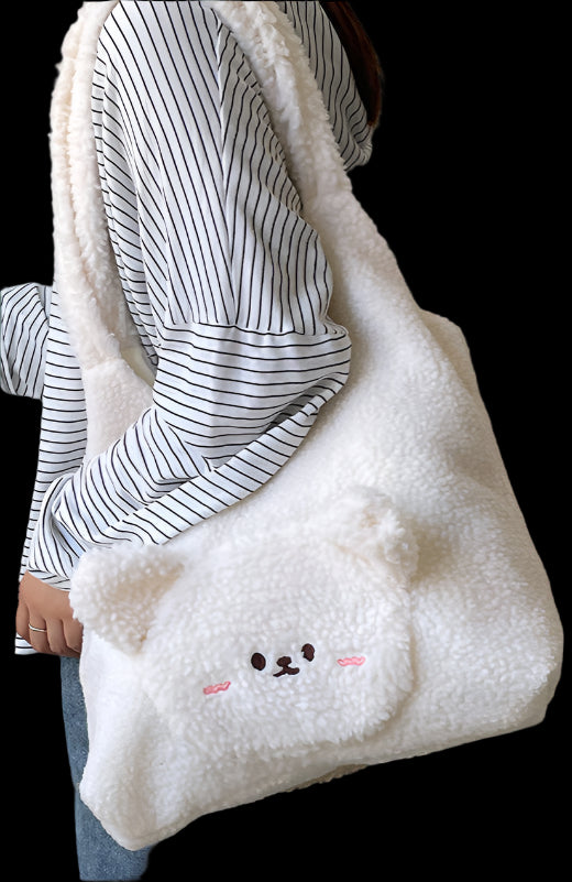 Person holding a fluffy white bag with a cartoon face design in a home setting.