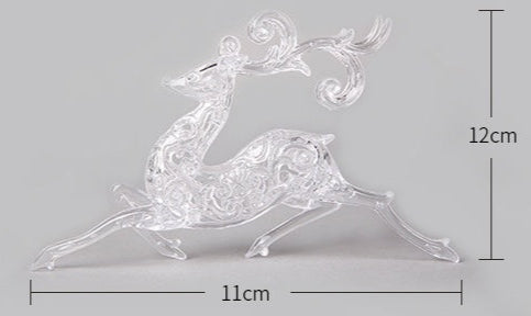Decorative glass deer figure with measurements on a gray background