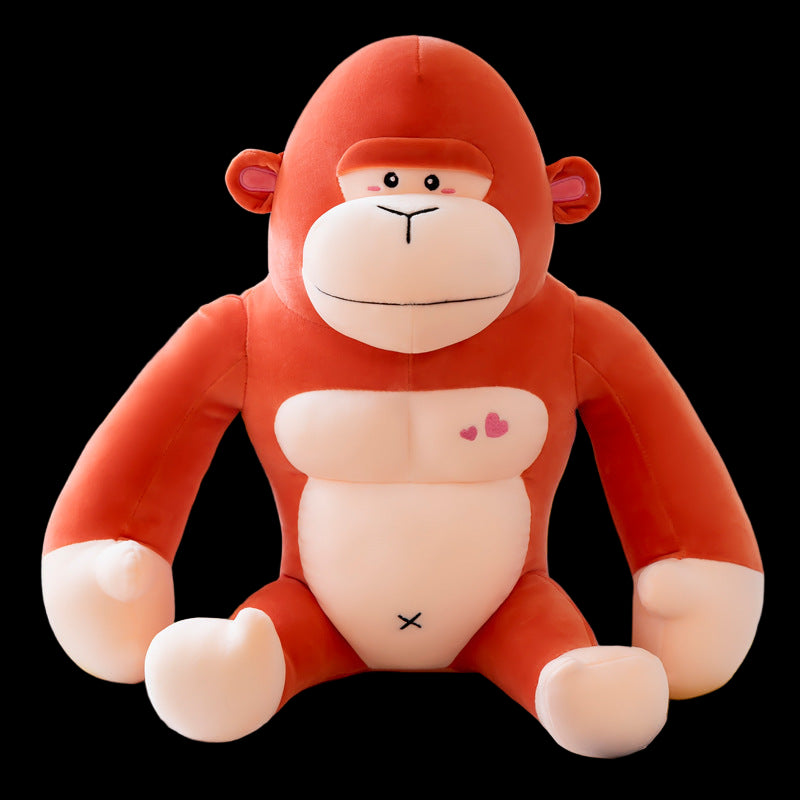 Plush monkey toy on a light-colored surface with a blurred background