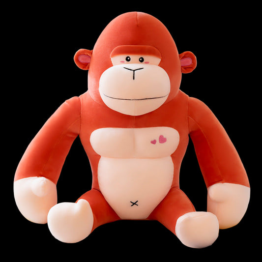 Plush monkey toy on a light-colored surface with a blurred background
