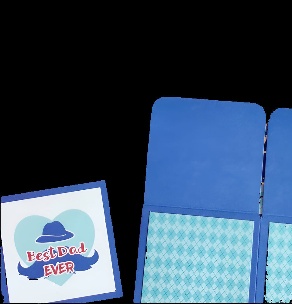 Blue notebook with a card that says 'Best Dad Ever' on a light background