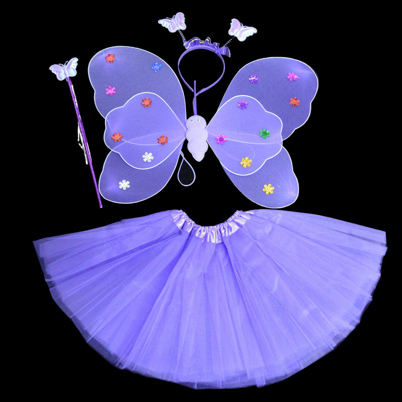 Purple fairy costume set with wings, wand, and headband on a black background