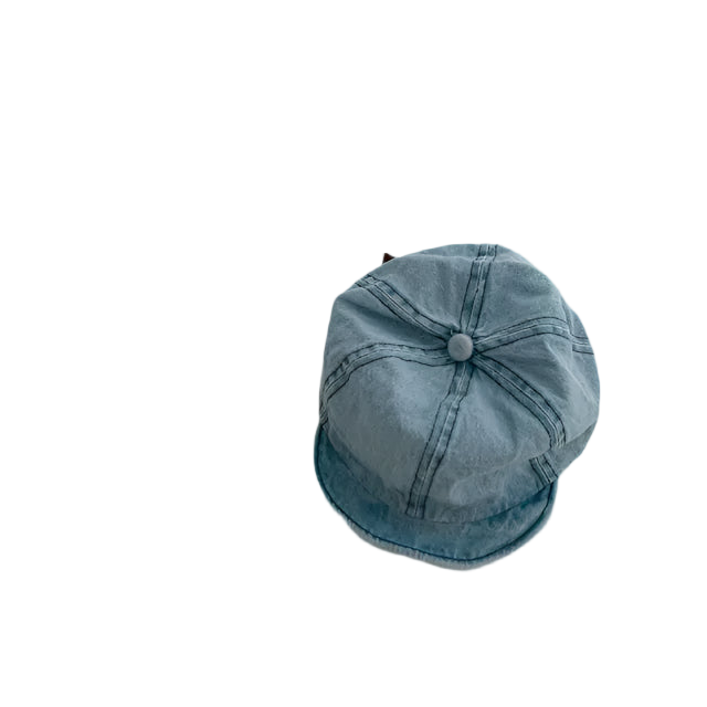 Blue denim cap on a light gray background