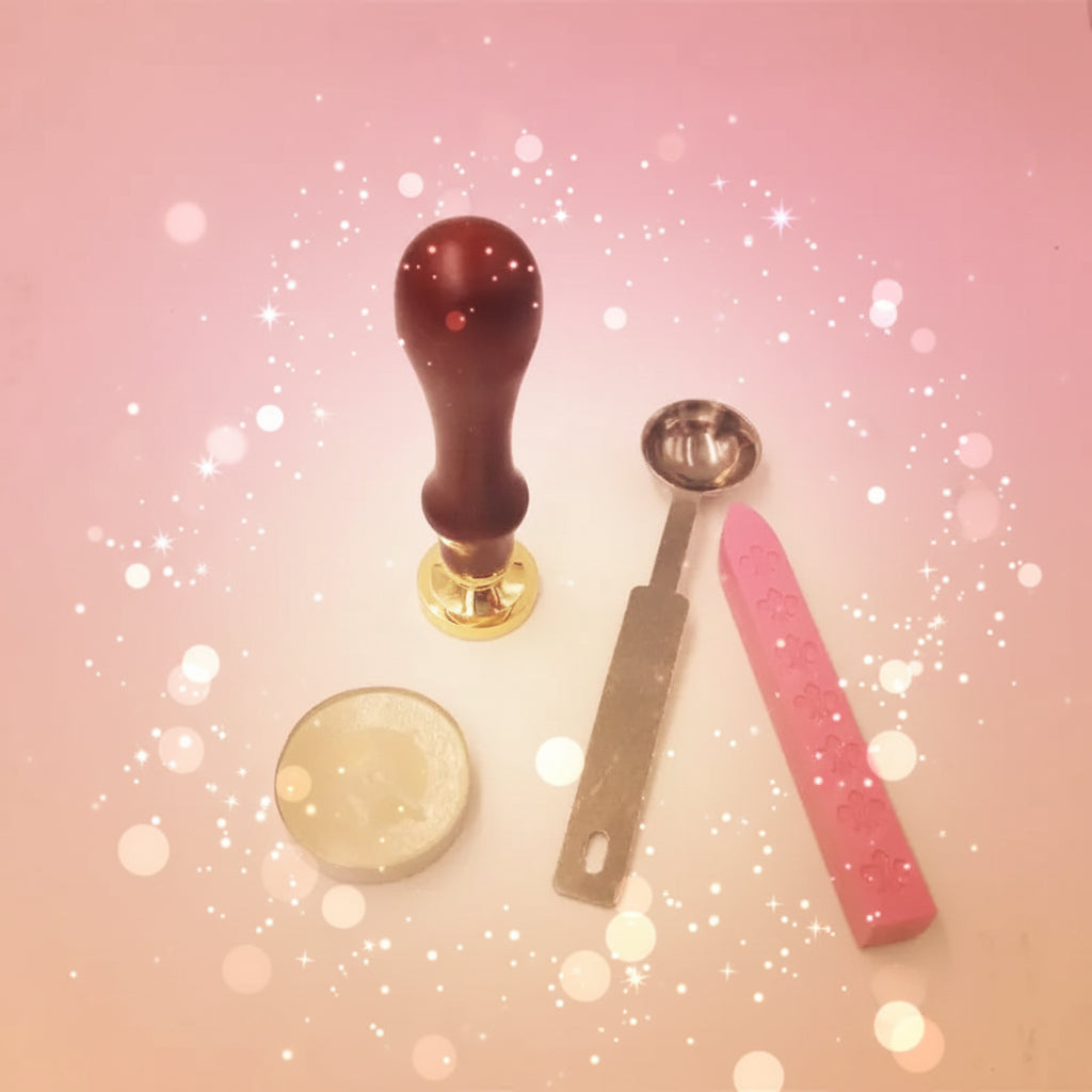 Collection of kitchen tools including a wooden handle, metal tool, pink measuring tool, and round container on a beige background.