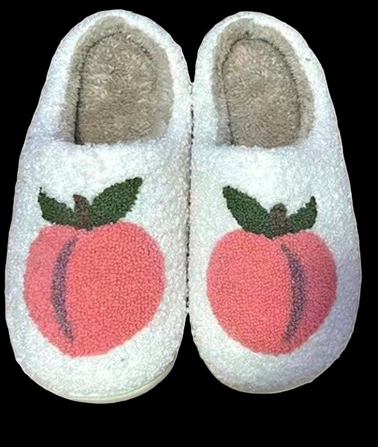 White slippers with peach design on a white background