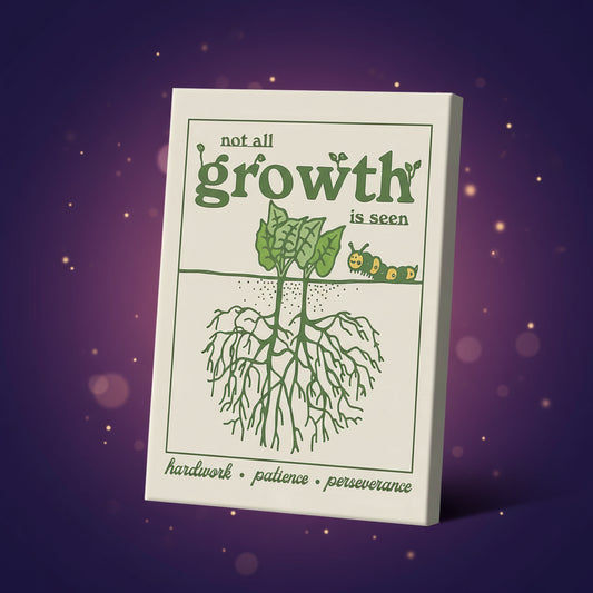 Canvas print with green illustration of a plant and caterpillar, and motivational text on a beige background.